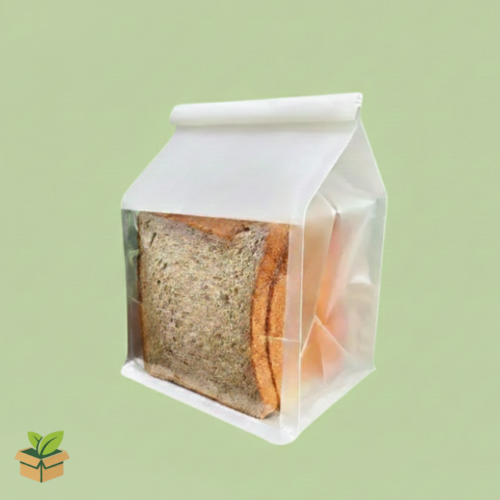 White side‑gusseted flat bottom pouch holding sliced bread on a light green background.