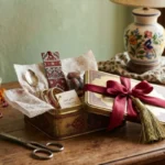 Tin Boxes for Gift Packaging in Pakistan – Decorative Gold Rectangle Tin with Red Ribbon